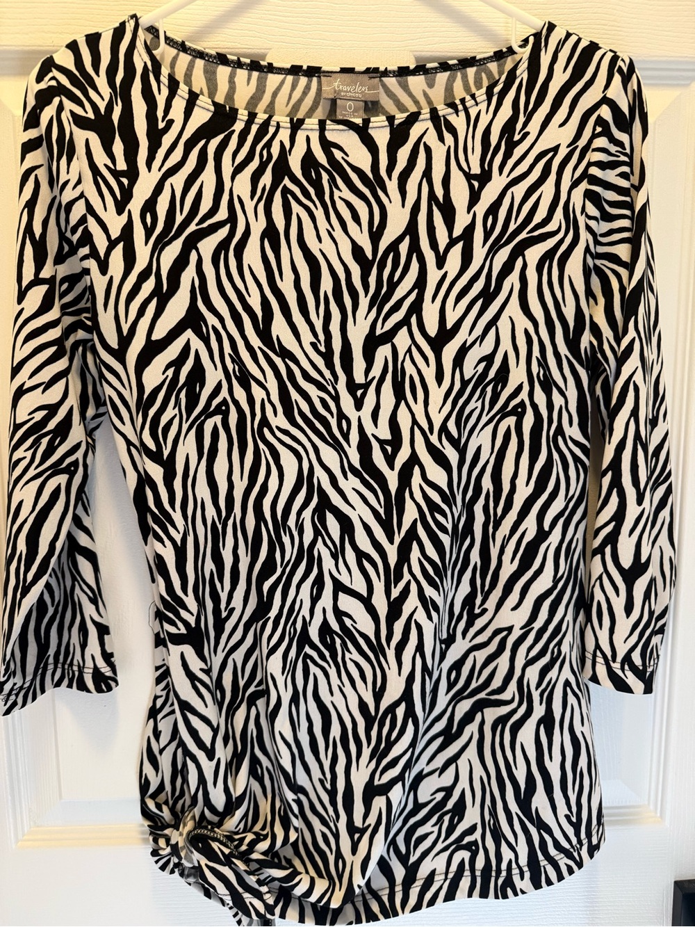 Chico’s Travelers Black and White Zebra-Print Top with side tie at hem - Size 0
